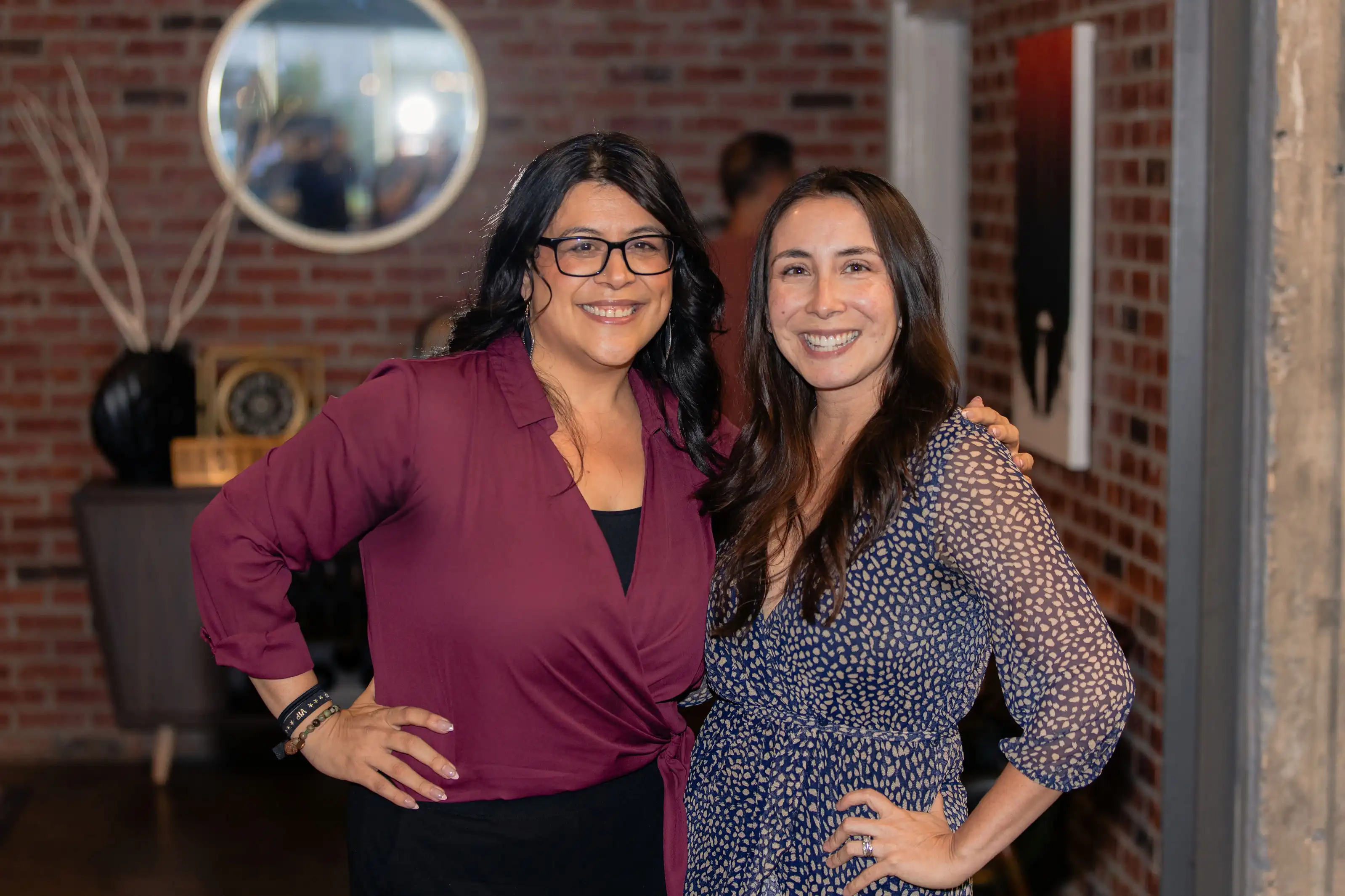 Two women posing together at TechFest 2024 networking event